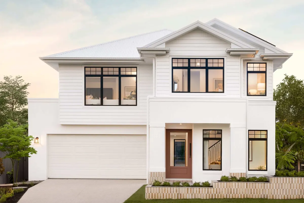 Double-storey home with dark cladding and stone entry blade